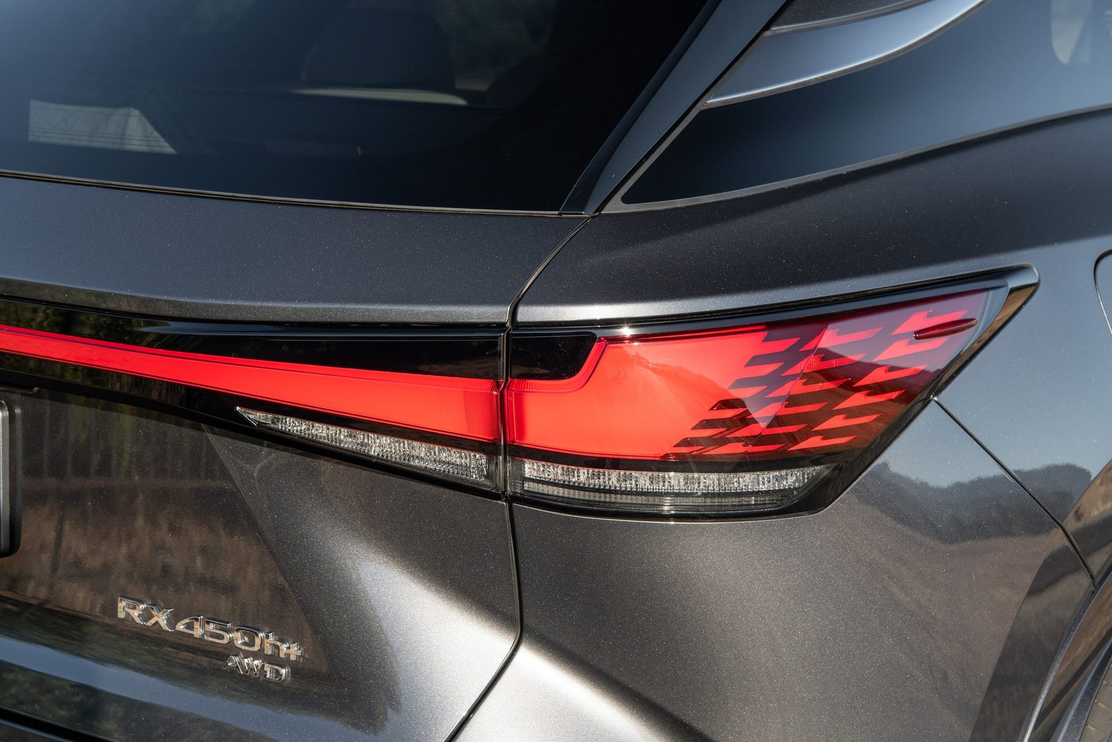 Lexus RX 450h+ 2024 — экстерьер, taillight badge detail, рынок global/Europe official newsroom